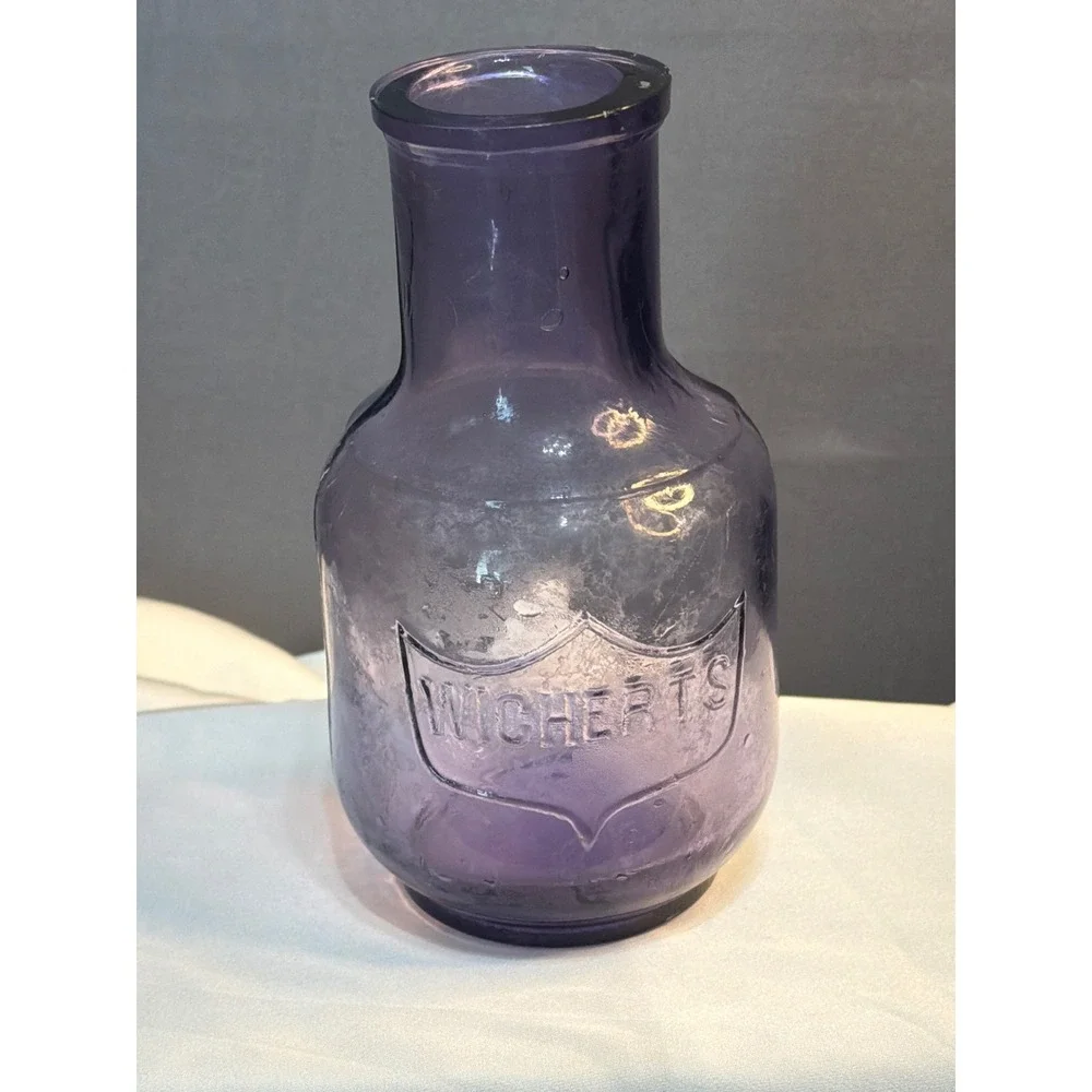 Vintage Wicherts Purple Amethyst Glass Bottle Embossed Shield Crest Apothecary